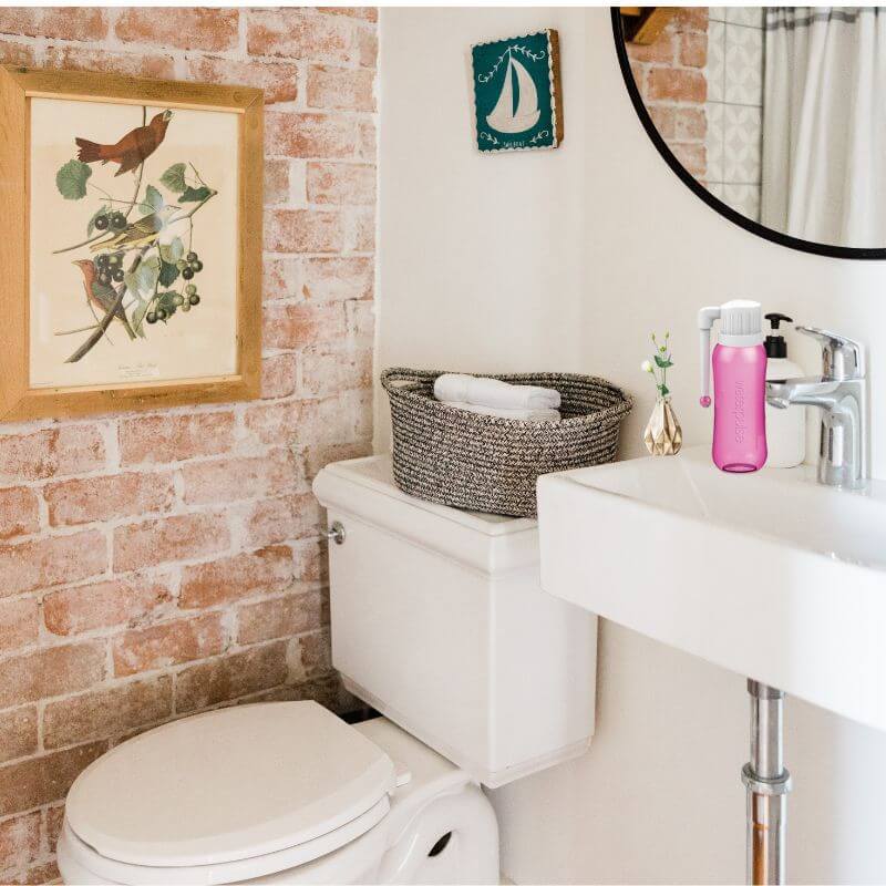 portable bidet sprayer handheld with a rotatable nozzle, the item in the washroom washing basin