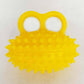 Spiky massage ball for hand and finger exercises, item on a cloth
