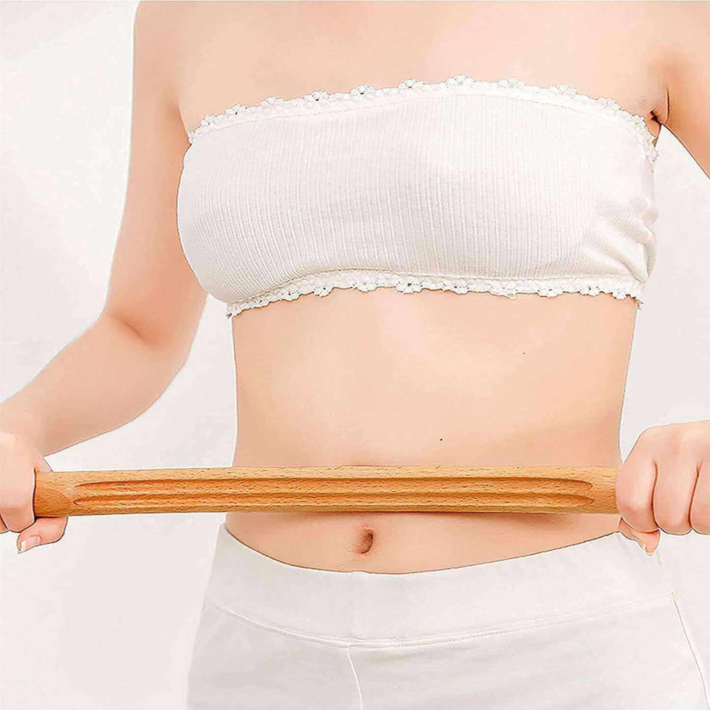 Wooden Gua Sha Massager for Therapy, item on the belly