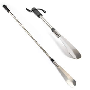 two fancy shoe horns with long metal handles, the orgininal length and the extended length